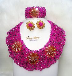 PrestigeApplause Pink with Silver Mixed with Gold Elegant Latest New Design African Beads Bridal Wedding Party Jewelry Set Complete Set is Necklace Earring and bracelet Wedding Party Bridal Special Occasion This detailed Jewellery set makes you stand out elegantly in any special occassion, it's all about glamour and uniqueness.  Buying more that 2 Jewellery set, we offer wholesale and bulk prices for all our jewellery. Multicolor Beaded Bridal Necklace For Party, Multicolor Beaded Necklaces For Wedding, Beaded Bridal Necklace With Round Beads For Parties, Handmade Pink Bridal Necklace For Wedding, Party Bridal Necklace With Polished Round Beads, Party Embellished Beaded Necklaces With Round Beads, Multicolor Faceted Beads For Wedding, Party Beaded Necklaces With Rhinestones And Round Beads, Multicolor Faceted Wedding Beads