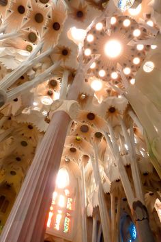 the inside of a large building with sunflowers on it's ceiling and stained glass windows