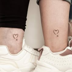 two small tattoos on the legs of people