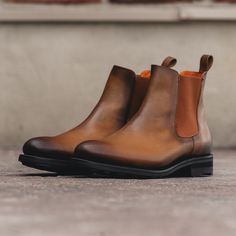 The classic coveted Chelsea boot featuring a modern styling. They are easy pull on and off which make these a quick and easy solution for any occasion. Features: Orange leather lining Box Calf Cognac Light Burnish Boot Cognac elastic City welt black heel/sole Handcrafted with Passion Goodyear Welt Construction Can be Resoled Boot For Men, Chelsea Boots Men, Black Heel, Orange Leather, Goodyear Welt, Stitching Leather, Men's Boots, Chelsea Boot, Leather Goods