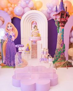 a princess themed birthday party with balloons and cake