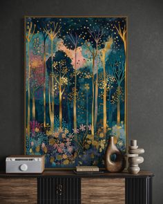 a painting is hanging on the wall above a console with a vase and radio in front of it