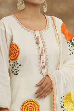 Off-white mulmul kurta with gold resham embroidery. Comes with pant and a dupatta.
Components: 3
Pattern: Embroidered
Type Of Work: Resham
Neckline: Round
Sleeve Type: Three quarter
Fabric: Mulmul
Color: Off White
Other Details: 
Tasseled work at placket on kurta
Occasion: Mehendi and Haldi - Aza Fashions Mulmul Kurta, Resham Embroidery, Kurta Pant Set, Types Of Work, Kurta With Pants, Pant Set, Set For Women, Aza Fashion, Sleeve Type