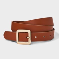 Instantly enhance any of your looks with this Chunky Center Bar Buckle Belt from A New Day™. This neutral tan belt offers easy styling with a range of outfits. It features a chunky square-shaped buckle closure for a touch of shine and chic style. This stylish women's belt with multiple holes provides an adjustable, secure fit around your waist. Whether paired with formal trousers or wrapped around the waist of a dress, this center bar belt lends on-trend flair to any outfit. A New Day™: Style th Trendy Brown Belt For Workwear, Brown Belts For Spring Workwear, Spring Handbags, Hoop Earring Set, Halloween Coustumes, Double Buckle Belt, Tan Belt, Formal Trousers, Silver Belts