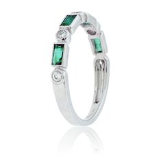 14K White Gold .14ctw Diamond and .77ctw Emerald Stackable Ring Beautiful bezels of 14K white gold surround each alternating emerald and diamond at the front of this band. Four emerald cut emeralds with a .77 carat total weight have been hand selected to match and provide the deep and rich green color of this band. Five brilliant round diamonds with a .14 carat total weight add a timeless elegance and an illuminating brilliance to the deep green emeralds. This band is designed to be stackable, p Diamond And Emerald Ring, Round Diamond Band, Detailed Ring, Rich Green, White Gold Band, Stackable Ring, Diamond Band, Emerald Ring, Stackable Rings