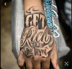 a person with a tattoo on their hand that says rock or die tryn '