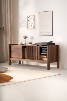 an entertainment center with a record player and speakers