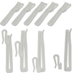 several white plastic handles and hooks on a white background