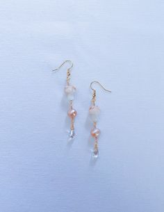 "Morning Dew on the Marsh Earrings 🍄🌷 Now available in silver or gold!  Part of the Hidden Garden Collection 2.5 inch dangle earrings  Made with lavender fresh water pearls, lampwork pink mushroom beads, iridescent teardrop glass beads; as well as anti tarnish wire & 18K gold plated or silver plated earring hooks. Also available in grey titanium or \"gold\" titanium hypoallergenic earring hooks! DM me on instagram about custom orders! Pearls & glass beads are delicate, please keep jewelry dry Dangle Crystal Earrings With Pearl Drop, Pink Pearl Drop Chandelier Earrings, Iridescent Pearl Drop Dangle Earrings, Iridescent Pearl Drop Earrings, Adjustable Teardrop Dangle Earrings With Pearl Drop, Pink Adjustable Pearl Drop Earrings, Adjustable Pink Pearl Drop Earrings, Adjustable Dangle Beaded Earrings With Pearl Drop, Adjustable Pearl Drop Dangle Beaded Earrings