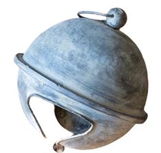 a large metal object with a handle on it's side and a ball at the top