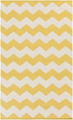 a yellow and white rug with zigzag stripes