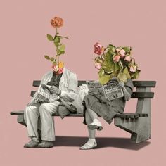 two people sitting on a bench with flowers