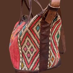 You're going to want to plan a weekend trip just so you can use this beautiful bag! Intertwined's beautifully crafted travel bag is handmade in Morocco from locally tanned leather and vintage, handwoven kilim. Each kilim is one-of-a-kind and handwoven with unique colors and patterns based on the region where it is made. Bohemian Rectangular Bag For Overnight Trips, Bohemian Leather Tote Travel Bag, Traditional Tote Travel Bag With Leather Handles, Travel Woven Satchel, Traditional Tote Weekender Bag For Travel, Traditional Travel Tote Bag With Leather Handles, Traditional Travel Bags With Leather Handles, Rustic Shoulder Bag With Leather Handles For Travel, Bohemian Woven Leather Travel Bags