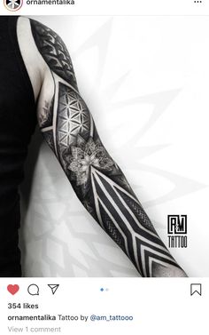 a man's arm with an intricate tattoo design on the left forearm and shoulder