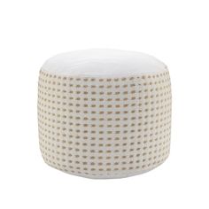 a white and gold dotted poufce with dots on it, sitting on a white surface