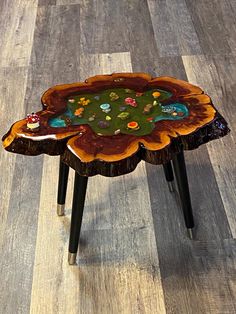 a wooden table sitting on top of a hard wood floor