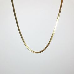 Elevate your everyday style with the Snake Herringbone Chain Necklace, a sleek and sophisticated piece designed to add effortless elegance to any outfit. Crafted from durable stainless steel and gold-plated for a luxurious finish, this 17" chain is perfect for layering or wearing alone. Its 4mm width gives it a bold yet refined appearance, making it a versatile addition to your jewelry collection. KEY BENEFITS Sleek & Timeless Design: A classic piece suitable for any occasion. Durable & Long-Las Classic Gold Link Herringbone Necklace, Gold Herringbone Necklace With Adjustable Chain, Gold Classic Herringbone Link Necklace, Classic Gold Snake Chain Necklace For Everyday, Minimalist Herringbone Necklace With Figaro Chain As Gift, Minimalist Gold Snake Chain Necklace, Gold Herringbone Necklace With Box Chain, Gold Herringbone Necklace With Box Chain For Everyday, Minimalist 14k Gold Snake Chain Necklace