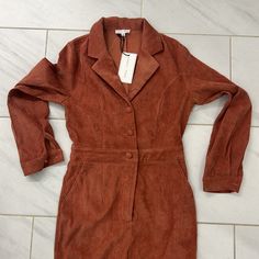 Brand New With Tags. Size Medium. Buttons Down The Front With Front Zipper. Flared Pant Legs. Red Jumpsuits And Rompers For Work In Fall, Red Jumpsuit For Workwear In Fall, Red Jumpsuit For Work In Fall, Fitted Long Sleeve Jumpsuits And Rompers For Day Out, Fitted Jumpsuits And Rompers For Fall Date Night, Fitted Jumpsuits And Rompers With Pockets For Date Night, Fitted Jumpsuits And Rompers For Fall Day Out, Red Fitted Jumpsuits For Day Out, Black Denim Jumpsuit