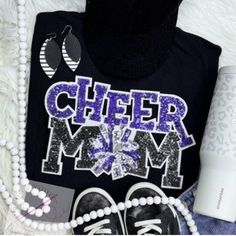 Grab this super cute Cheer Mom sequin patch shirt in a Comfort Colors shirt, long sleeve, or Gildan crewneck sweatshirt! Choose between pink, red, purple, gold, royal blue, or green for the patch and personalize it even more with an embroidered name or team name. A perfect gift for a cheer mom or the perfect shirt for mom during cheer season.  Care Instructions: Hand wash or delicate cycle. Hang dry.  See other items in my shop: http://www.etsy.com/shop/sarahricecreative Casual Glitter Print Tops For Cheerleading, Casual Crew Neck T-shirt With Sequins, Casual Crew Neck Tops With Glitter Print, Long Sleeve Cotton Tops With Glitter Print, Team Spirit Crew Neck Top With Glitter Print, Black Glitter Print T-shirt For Cheerleading, Black Cotton T-shirt With Glitter Print, Cheerleading Glitter Print Crew Neck T-shirt, Cheerleading T-shirt With Glitter Print Crew Neck