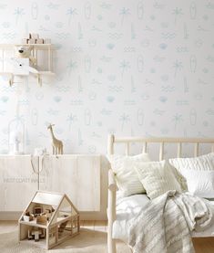 a child's bedroom decorated in white and blue