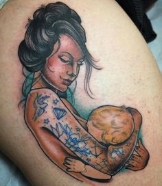 a woman holding a bagel tattoo on her arm