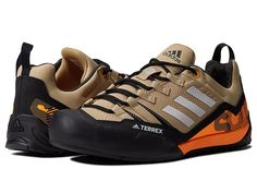 adidas Outdoor Terrex Swift Solo 2 - Athletic Shoes : Beige Tone/Grey One/Flash Orange : Play your favorite sports or go for hiking wearing adidas Outdoor Terrex Swift Solo 2 footwear. Textile upper. Textile lining and molded sockliner. Molded toe cap. Lace closure. EVA stabilization frame and boost midsole. External heel support clip. Abrasion-resistant welding. Rubber outsole with rough terrain zone. Imported. Weight of footwear is based on a single item, not a pair. Adidas Athleisure Sneakers For Outdoor Activities, Adidas Dynamic Trail Running Shoes, Adidas Breathable Functional Trail Running Shoes, Adidas Breathable Sneakers For Outdoor Activities, Adidas Low-top Trail Running Shoes For Outdoor, Adidas Functional Outdoor Sneakers, Adidas Sporty Hiking Boots For Outdoor Activities, Casual Adidas Running Shoes For Trail, Waterproof Casual Hiking Boots For Climbing