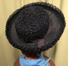 "This is a fun vintage hat, that dates from the 1950s or 60s. It is a boater style hat. Labeled \"Jacki\". It features a large, upturned brim, & grosgrain ribbon band & bow trim. Made of textured, loopy, poly raffia straw. Brim is about 3.5\" wide all around. It measures 21\" around the inside. It is in very good, vintage condition. No soil or stains. Nice & clean. Lovely!" Vintage Short Brim Party Hats, Victorian Hats For Church And Kentucky Derby, Victorian Brimmed Hat For Kentucky Derby, Retro Wide Brim Hats For Vintage Events, Brimmed Mini Hats For Church, Victorian Hat With Short Brim For Church, Victorian Wide Brim Hat For Church, Vintage Hat With Curved Brim And Lining, Vintage Brimmed Top Hat For Party