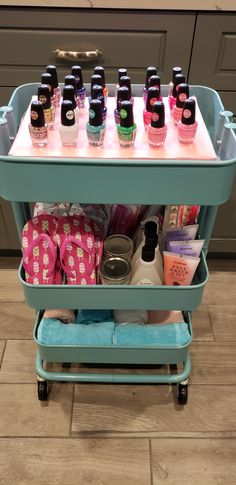 a cart filled with lots of bottles on top of a tiled floor