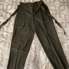 New Never Worn Pants In Woven Fabric. High Waist With Pleats, Removable Tie Belt, And Zip Fly With Concealed Hook-And-Eye Fastener. Side Pockets With Tapered Legs With Creases. True To Size. H&m Tapered Leg Bottoms For Spring, Khaki Belted Bottoms For Work, High Waist Belted Khaki Bottoms, Khaki Belted Workwear Bottoms, High Waist Khaki Bottoms For Office, High-waist Khaki Bottoms For Office, Green Belted Pants For Workwear, H&m Tapered Leg Spring Bottoms, H&m High Waist Bottoms With Pockets