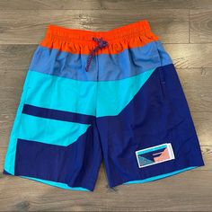 Brand New Nike Beach Shorts With Pockets, Nike Vacation Shorts, Nike Shorts With Pockets For The Beach, Nike Casual Vacation Bottoms, Sporty Nike Bottoms For Vacation, Retro Blue Bottoms For Streetwear, Nike Blue Shorts For Beach, Blue Sporty Shorts For Summer, Blue Sporty Shorts For Beach Season