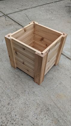 a wooden box sitting on the ground