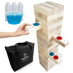 a wooden tower with red, white and blue buttons next to a black shopping bag