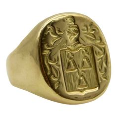 This 18k gold Tiffany & Co. Larter & Sons signet ring is hand carved with a heraldic family crest. The crest has a shield with three bell-like shapes sprouting flowers. Above the shield is a knight’s helmet topped with a feather and surrounded by scrolling foliate. The classic design of the crest suggests royalty and valor.  Larter & Sons was founded in 1865 and was renowned for their exquisite craftsmanship of men’s accessories. They expanded to include women’s jewelry in the early 20th century, using intricate techniques such as guilloche and enamelwork, and incorporating motifs inspired by nature. They collaborated with Tiffany & Co. to make jewelry such as cufflinks and signet rings. Tiffany & Co. would often consign well-known brands of the highest quality, including Larter & Sons. Collectible Yellow Gold Signet Ring With Engraving Option, Timeless Hallmarked Signet Ring Collectible, Timeless Hallmarked Collectible Signet Ring, Timeless Hallmarked Signet Ring For Collectors, Classic 14k Stamped Signet Ring For Commemoration, Timeless Gold Signet Ring, Luxury 14k Stamped Collectible Signet Ring, Heirloom 14k Gold Signet Ring For Commemoration, 14k Gold Heirloom Signet Ring For Commemoration