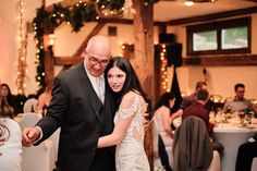 a bride and groom dancing at their wedding reception