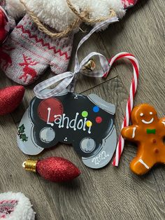 some christmas ornaments are laying on the floor next to a teddy bear and candy canes