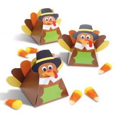 turkey treat boxes with candy candies in the shape of their heads and hands, on a white background