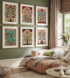 a living room filled with furniture and paintings on the wall above it's coffee table