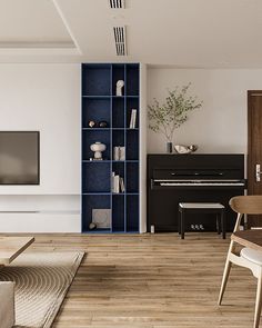 a living room filled with furniture and a flat screen tv sitting on top of a wooden floor