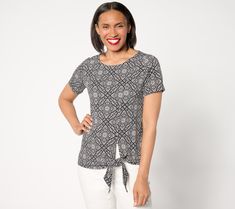 Covered in a pretty printed pattern, this short-sleeve top is a prime pick for the events on your summer social calendar. Liquid Knit® fabric gracefully drapes over the body, while a side-tie detail adds a chic finishing touch. From Susan Graver. Summer Knit Top For Day Out With Short Sleeves, Fitted Patterned Top With Short Sleeves, Patterned Fitted Short Sleeve Tops, Fitted Patterned Short Sleeve Tops, Fitted Short Sleeve Knit Top For Summer, Fitted Patterned Top For Day Out, Printed Short Sleeve Tops For Day Out, Fitted Short Sleeve Knit Top For Day Out, Fitted Knit Top With Short Sleeves For Day Out