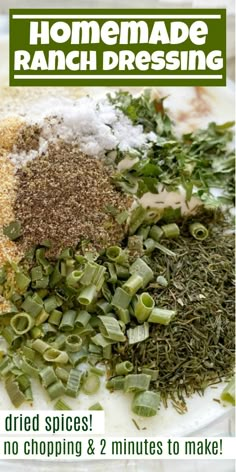 the ingredients to make homemade ranch dressing on a white plate with green onions and seasoning