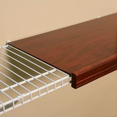 a close up of a metal shelf with wood