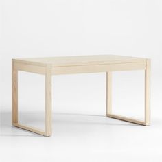 a wooden table sitting on top of a white floor