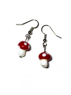 Mushroom earrings red and white glass stainless steel dangle #etsy #red #silver #glass #earwire #witchy #stainlesssteel #mushroom Red Mushroom Design Earrings Gift, Green Mushroom Design Dangle Earrings, Whimsical Dangle Earrings With Mushroom Design, Fairy Look, Nature-inspired Mushroom Design Dangle Jewelry, Whimsical Mushroom-shaped Earrings For Gifts, Cottagecore Fairy, Mushroom Earrings, Earrings Classic