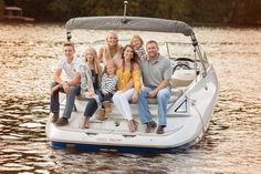 a group of people sitting on the back of a boat