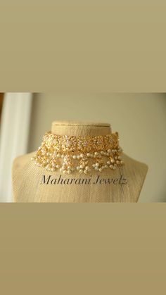 Delicate choker set with embedded pearl work in a goldplated frame. Bollywood Tilla Choker For Wedding, Bollywood Style Tilla Choker For Weddings, Gold Bollywood Lehenga For Marriage, Bollywood Style Gold Lehenga For Marriage, Gold Kundan Choker With Cutdana, Traditional Gold Choker For Reception, Bollywood Heavy Choker For Wedding, Wedding Choker With Cutdana Detail, Heavy Gold Lehenga For Reception