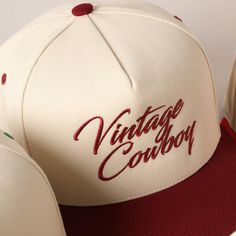 Vintage Cowboy Embroidery Two-Tone Baseball Cap - "Vintage Cowboy" Text Embroidery - 5 Panel Canvas Baseball Cap - 100% Cotton - Adjustable Buckle Closure - Embroidered In USA *One Size Fits All - Adjustable Strap Makes Fit Comfortable.* The VANTAGE Two-Tone Embroidery Trucker Hat blends style and functionality with its distinctive design. The hat features a two-tone color scheme, combining a vibrant or contrasting color on the front panels with a complementary. The embroidered detailing on the Vintage Snapback Hat With Letter Print And Curved Brim, Vintage White Snapback Hat With Letter Print, Vintage Snapback Hat With Letter Print, Vintage White Trucker Hat With Letter Print, Vintage White Baseball Cap With Letter Print, Vintage Baseball Cap With Letter Print And Flat Brim, Retro Embroidered Logo Snapback Hat, Vintage Letter Print Snapback Baseball Cap, Retro Embroidered Logo 5-panel Snapback Hat