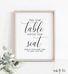 a framed print with the words, find your table choose your seat to save your seat