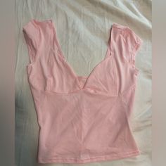 Very Fitted, Somewhat Cropped, Never Worn, Bought Off Tiktok Shop, Somewhat See Through. Pink Tops With Built-in Bra For Day Out, Pink Top With Built-in Bra For Night Out, Pink Cropped Fitted Top, Pink Cropped Top With Built-in Bra, Pink Fitted Sleeveless Top, Fitted Pink Top With Built-in Bra, Pink Fitted Crop Top, Feminine Stretch Crop Top, V-neck Top With Built-in Bra For Day Out