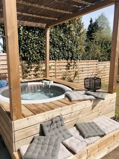 a hot tub sitting on top of a wooden deck