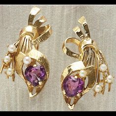 14k Yellow Gold Screw Back Earrings Depicting A Floral Bouquet Design. Each Earring Is Set With One Heart Shaped Faceted Amethyst Measuring 7mm And Four 2.5mm Pearls. 1 And 3/8 Inches And 8.6 Grams. In Very Excellent Condition! Vintage Amethyst Purple Earrings, Purple Fine Jewelry Earrings For Formal Occasions, Purple 14k Gold Earrings With Prong Setting, 14k Gold Purple Earrings With Prong Setting, Elegant Purple 14k Gold Earrings, Elegant Purple Clip-on Earrings, Formal Purple Clip-on Jewelry, Bouquet Design, Amethyst Earrings